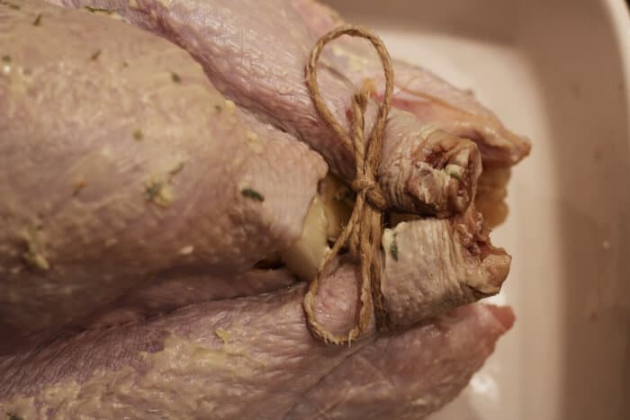 How to Cook a Pastured Turkey - Tie Turkey Legs with Twine | The Prairie Homestead