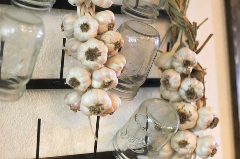 hanging braided garlic in kitchen